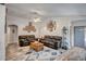 Comfortable living room with plush seating, a ceiling fan, and decorative accents at 15558 N Ulrich Way, Surprise, AZ 85374
