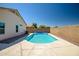 Private pool with surrounding patio, offering a refreshing outdoor oasis ideal for relaxation and entertainment at 15558 N Ulrich Way, Surprise, AZ 85374
