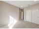 Bedroom featuring closet, carpeted floor and neutral walls at 16689 W Whispering Wind Dr, Surprise, AZ 85387