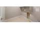 Practical laundry room with modern hookups and ample space at 16689 W Whispering Wind Dr, Surprise, AZ 85387