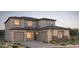 Beautiful two-story home with three-car garage and stone accents at 16711 W Questa Dr, Surprise, AZ 85387