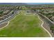 Aerial view of the community park featuring walking trails, green spaces, and mountain views at 17235 W Statler St, Surprise, AZ 85388
