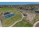 Aerial view of community park featuring playground, skate park, and sport courts at 17235 W Statler St, Surprise, AZ 85388
