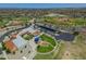 Aerial view of the school including a playground with green grass and modern facilities at 17235 W Statler St, Surprise, AZ 85388