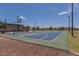 Well-maintained basketball court with clean lines, blue and green accents, perfect for recreational play, and community event at 17235 W Statler St, Surprise, AZ 85388