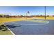 Basketball court featuring vibrant blue and green sections, set in a Gathering-friendly neighborhood, with sports and activity at 17235 W Statler St, Surprise, AZ 85388