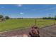 Beautiful green community park space, perfect for outdoor activities and relaxation at 17235 W Statler St, Surprise, AZ 85388