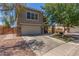 Two-story home with neutral stucco, stone accents and a 2 car garage at 17235 W Statler St, Surprise, AZ 85388