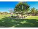 Community gazebo offers seating beneath a canopy of trees at 17235 W Statler St, Surprise, AZ 85388