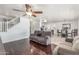Open floor plan with living room, dining area, and kitchen with dark wood floors at 17235 W Statler St, Surprise, AZ 85388