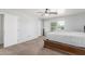 A large main bedroom with carpet floors, a ceiling fan and a carved, ornate bed at 17235 W Statler St, Surprise, AZ 85388