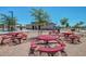 Picnic area with multiple tables near community center and playground at 17235 W Statler St, Surprise, AZ 85388