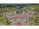 Aerial view of a modern skate park offering varied ramps and rails for skaters, part of community amenities at 17235 W Statler St, Surprise, AZ 85388