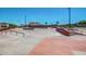 Skate park with a variety of ramps, rails, and concrete features, designed for skaters of all levels, in a neighborhood at 17235 W Statler St, Surprise, AZ 85388