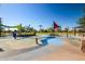 Community splash pad with play structures at 17235 W Statler St, Surprise, AZ 85388