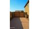 Paver driveway leading to a fenced backyard area, perfect for outdoor activities at 17427 W Hadley St, Goodyear, AZ 85338