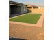 Well maintained backyard with brickwork and green turf, perfect for outdoor activities at 17427 W Hadley St, Goodyear, AZ 85338