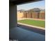 Inviting outdoor space featuring a well-kept lawn and a secure block wall for privacy at 17427 W Hadley St, Goodyear, AZ 85338
