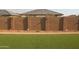 Fully fenced backyard with artificial turf, providing privacy and low maintenance at 17427 W Hadley St, Goodyear, AZ 85338