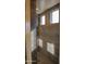 Neutral shower featuring tiled surround with windows at 17427 W Hadley St, Goodyear, AZ 85338