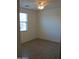 Clean bedroom with natural light from the window and neutral finishes at 17427 W Hadley St, Goodyear, AZ 85338