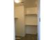 Walk-in closet with built-in shelving and lighting at 17427 W Hadley St, Goodyear, AZ 85338