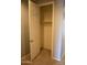 A well-lit closet with a rod and tiled flooring provides ample storage space at 17427 W Hadley St, Goodyear, AZ 85338