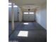 Spacious two-car garage with concrete floors and modern garage doors at 17427 W Hadley St, Goodyear, AZ 85338