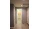 View of hallway with tile flooring, neutral walls, and a doorway to a closet at 17427 W Hadley St, Goodyear, AZ 85338