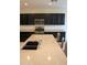 Granite island countertops with undermount sink and faucet at 17427 W Hadley St, Goodyear, AZ 85338