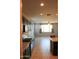 Open floor plan with direct view from kitchen to the living room, plenty of light, modern feel at 17427 W Hadley St, Goodyear, AZ 85338