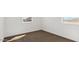 Bedroom with carpeted floor and two windows with neighborhood views at 1785 W Solstice Ave, Apache Junction, AZ 85120