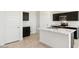 A view of the kitchen featuring black cabinets, white countertops, and stainless steel appliances at 1785 W Solstice Ave, Apache Junction, AZ 85120