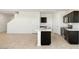 Modern kitchen features an island, black cabinetry, and stainless steel appliances at 1785 W Solstice Ave, Apache Junction, AZ 85120
