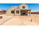 Large backyard with a fire pit, covered patio, and plenty of room to customize at 18663 W Vogel Ave, Goodyear, AZ 85338