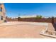 Large, empty backyard with space for customization and block wall fence at 18663 W Vogel Ave, Goodyear, AZ 85338