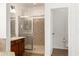 Bathroom with granite countertops, shower and a separate toilet area with tile flooring at 18663 W Vogel Ave, Goodyear, AZ 85338