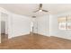 Bright bedroom with tile flooring, ceiling fan, and a doorway at 18663 W Vogel Ave, Goodyear, AZ 85338