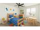 bedroom with colorful decor, a wooden bed, and playful artwork at 18663 W Vogel Ave, Goodyear, AZ 85338