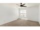Bedroom featuring a window and neutral colored carpet at 18663 W Vogel Ave, Goodyear, AZ 85338