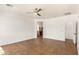 Bright bedroom with tile flooring, ceiling fan, and a doorway at 18663 W Vogel Ave, Goodyear, AZ 85338