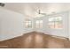 Bright, spacious bedroom featuring tile floors and three sunny windows at 18663 W Vogel Ave, Goodyear, AZ 85338