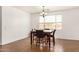 Bright dining area features a stylish chandelier and a cozy table for four at 18663 W Vogel Ave, Goodyear, AZ 85338