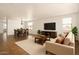 Open concept living and dining area with tile flooring and neutral tones at 18663 W Vogel Ave, Goodyear, AZ 85338