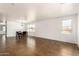 Open living room with tile floors, bright windows, and contemporary lighting at 18663 W Vogel Ave, Goodyear, AZ 85338