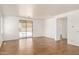 Open living room boasts tile floors and sliding doors to the backyard at 18663 W Vogel Ave, Goodyear, AZ 85338