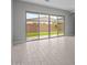 Bright living room featuring large sliding glass doors that provide backyard views and allow natural light to flood the space at 19321 W Luke Ave, Litchfield Park, AZ 85340