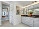 Elegant bathroom featuring double sinks, stylish vanity, and ample counter space at 19426 W San Juan Ave, Litchfield Park, AZ 85340