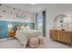 Charming bedroom with fun decor and ample natural light, creating a welcoming atmosphere at 19426 W San Juan Ave, Litchfield Park, AZ 85340
