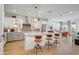 Bright, open kitchen featuring white cabinets, stainless steel appliances, and a large island with seating at 19426 W San Juan Ave, Litchfield Park, AZ 85340
